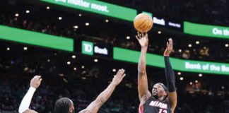 Miami Heat’s Bam Adebayo (13) shoots against the defense of Boston Celtics’ Jaylen Brown (7). PHOTO COURTESY OF DAVID BUTLER II-USA TODAY SPORTS