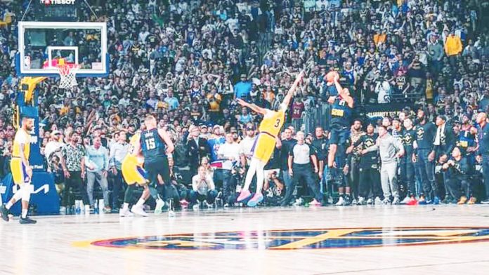 sports_murray_resized Denver Nuggets’ Jamal Murray shoots a game-winning basket against the defense of Los Angeles Lakers’ Anthony Davis. PHOTO COURTESY OF DENVER NUGGETS
