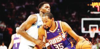 Phoenix Suns’ Kevin Durant drives to the basket against Minnesota Timberwolves’ Anthony Edwards. PHOTO BY DAVID BERDING/GETTY IMAGES