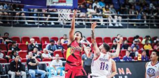 San Miguel Beermen’s Celedonio Trollano goes for a layup against the defense of NLEX Road Warriors’ Robbie Herndon. PBA PHOTO
