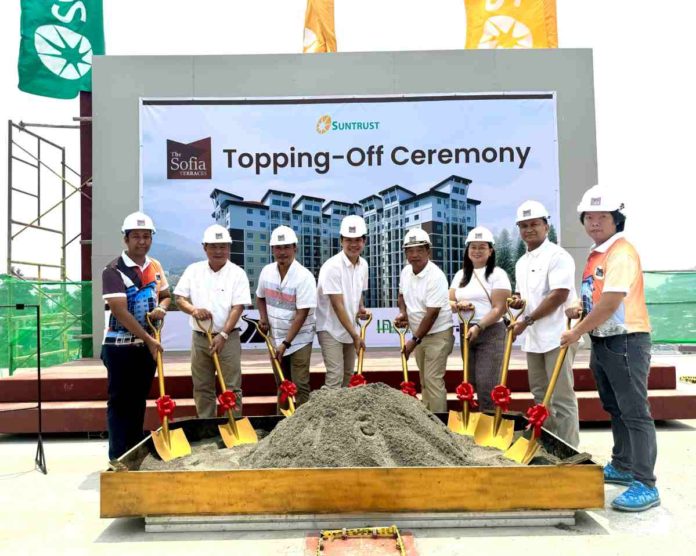 sun-trust In photo are officials from Suntrust and its partners present at the topping off: (from left) Engr. Wilfredo Cabalce Jr., Cabalce Electrical Contractors, Assistant Vice President, Jerry R. Rubis, Suntrust First Vice President for Sales, Marketing, and Training, Isaias D. Berdin Jr., Suntrust Vice President for Operations, Planning, and Design, Atty. Basilio C. Almazan Jr., Suntrust Senior Vice President, Virgilio Bucat, Sagada Construction and Development Corporation President, Marjorie Bucat, Sagada Construction and Development Corporation Vice President, Arch. Manolito V. Elmann, Suntrust Assistant Vice President - Vertical Operations, Arnel Abalos, HOABI HR Executive.