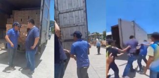 Tobias Fornier, Antique’s Mayor Ernesto Tajanlangit (left) and Vice Mayor Jojo Fornier (right) confront one another at the back of a van carrying family food packs on Monday, April 29. Mayor Ernesto Tajanlangit/FB