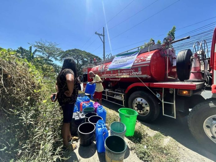 Residents of Barangay Balabago, Jaro, Iloilo City who were affected by the scheduled power interruption on April 21 got free water from MORE Electric and Power Corporation. PHOTO BY MORE POWER