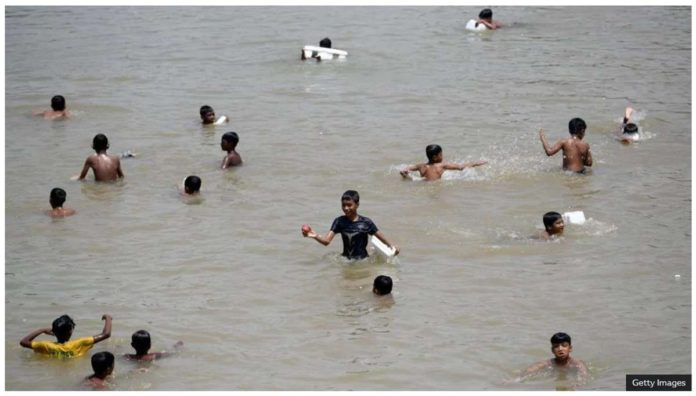 world_bangladesh_resized Children cool off in a lake on a hot day in Dhaka, the capital of Bangladesh. Getty Images