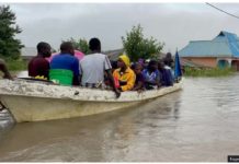 People are being rescued in a canoe in Rufiji district in a coastal region of Tanzania. EAGAN SALLA /BBC