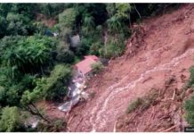 A view of a house in a flooded area taken from a helicopter. BRAZILIAN AIR FORCE