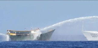 Philippine resupply vessel Unaizah May 4 (left) is hit by two Chinese coast guard water cannons as they tried to enter the Second Thomas Shoal, locally known as Ayungin Shoal, in the disputed South China Sea on March 5, 2024. For the first time, China has publicized what it claims is an unwritten 2016 agreement with the Philippines over access to South China Sea islands. AP PHOTO/AARON FAVILA, FILE