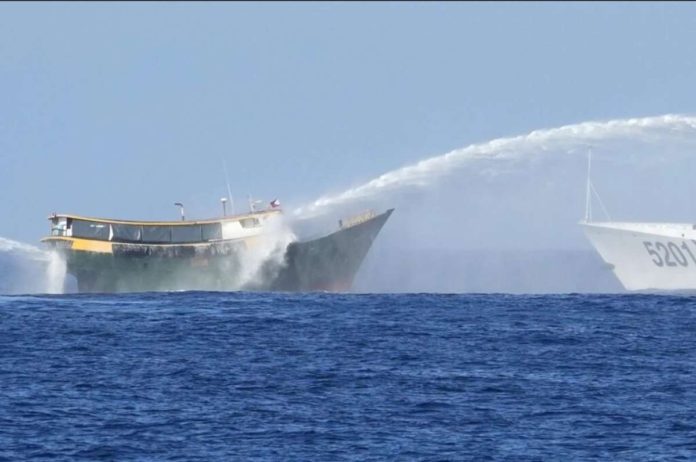 China_resized Philippine resupply vessel Unaizah May 4 (left) is hit by two Chinese coast guard water cannons as they tried to enter the Second Thomas Shoal, locally known as Ayungin Shoal, in the disputed South China Sea on March 5, 2024. For the first time, China has publicized what it claims is an unwritten 2016 agreement with the Philippines over access to South China Sea islands. AP PHOTO/AARON FAVILA, FILE