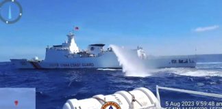A China Coast Guard ship fires its water cannon at Philippine Coast Guard (PCG) vessels escorting supply boats chartered by the Armed Forces of the Philippines in this August 2023 photo. The Philippine boats were delivering supplies to troops at BRP Sierra Madre in Ayungin (Second Thomas) Shoal when confronted by the Chinese. VIDEOGRAB FROM PCG FACEBOOK PAGE