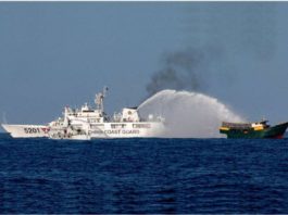 A Chinese Coast Guard vessel fires its water cannon at the Philippine resupply vessel Unaizah on its way to a resupply mission at Ayungin (Second Thomas) Shoal in the West Philippine Sea. REUTERS