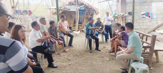 Dr. Ernesto Servillon Jr. (center), Schools Division Superintendent of Iloilo Province, visits the bereaved family of a Grade 10 student in Maasin, Iloilo to convey condolences and address the family's call for justice, on Monday, May 13. SDO ILOILO PROVINCE PHOTO