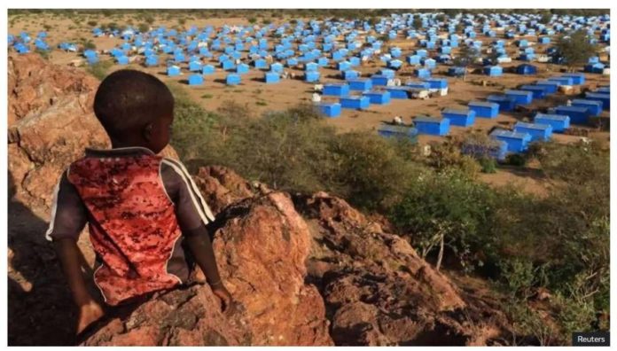 Sudan_resized A boy sits atop a hill overlooking a refugee camp near the Chad-Sudan border. Paramilitary forces in Sudan are being accused of an ethnic cleansing amid a civil war. REUTERS