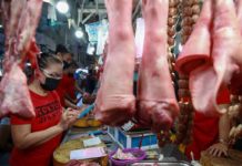 Vendors tend to their stalls at the Guadalupe Public Market in Makati City. JONATHAN CELLONA/ABS-CBN NEWS PHOTO