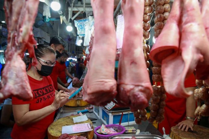 Vendors tend to their stalls at the Guadalupe Public Market in Makati City. JONATHAN CELLONA/ABS-CBN NEWS PHOTO