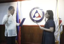 Arcos takes oath as a Member of the Social Security Commission Labor Secretary and Ex-Officio Social Security Commissioner Bienvenido E. Laguesma facilitates the oath taking of Commissioner Eva B. Arcos in Intramuros, Manila on April 24, 2024.