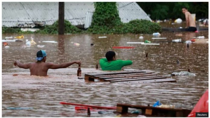 brazil_resized People wade through flooded streets in Encantado, Rio Grande do Sul state, southern Brazil. The municipality of Encantado has turned into a river, as residents have been desperately trying to move to higher ground. Reuters