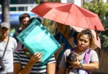 Umbrella, cap and even a plastic folder shield pedestrians from the punishing heat in Caloocan City. The country may have already logged the highest actual temperature for 2024, the Philippine Atmospheric, Geophysical, and Astronomical Services Administration said. PNA