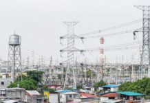 High voltage towers that support transmission lines for electrical power distribution in the Luzon grid are seen from a residential area in Baesa, Quezon City. MARIA TAN/ABS-CBN NEWS PHOTO