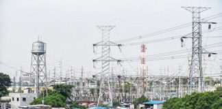 High voltage towers that support transmission lines for electrical power distribution in the Luzon grid are seen from a residential area in Baesa, Quezon City. MARIA TAN/ABS-CBN NEWS PHOTO