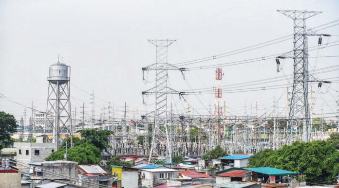 electricity_bills High voltage towers that support transmission lines for electrical power distribution in the Luzon grid are seen from a residential area in Baesa, Quezon City. MARIA TAN/ABS-CBN NEWS PHOTO