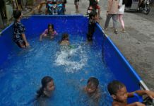 Children at a neighborhood at Blumentritt Road in Manila cool off at an inflatable pool. RICHARD A. REYES, PHILIPPINE DAILY INQUIRER