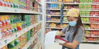 A Department of Trade and Industry Region 6 personnel monitors the prices of basic necessities. Consumers, especially those in areas under a state of calamity, are encouraged to report retailers selling basic necessities above the specified price freeze. PHOTO FROM DTI-REGION 6