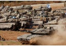 Israeli military tanks are positioned near the Gaza Strip. REUTERS