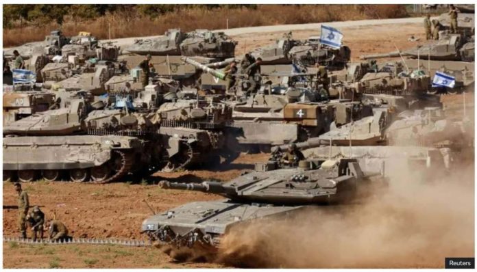 israel_resized Israeli military tanks are positioned near the Gaza Strip. REUTERS