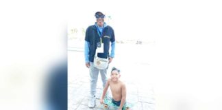 Swimming sensation Zach Lucas Obsioma and his coach Max Fermales. PHOTO BY MARIA EVIA OBSIOMA