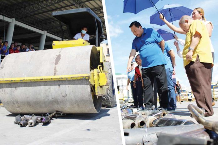 mufflers Mayor Jerry Treñas (right photo) leads the crushing of illegally modified mufflers on Friday, May 17. He says the Iloilo City Government is implementing stringent measures to curb loud mufflers on motorcycles to promote a more peaceful and comfortable environment for the residents. AJ PALCULLO/PN