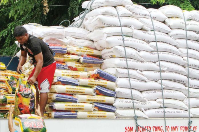 rice_import The Philippines’ 2025 rice imports were projected to climb even higher than the expected 4.1 million metric tons, according to the United States Department of Agriculture monthly global grains report for May. Photo shows porters loading sacks of rice to be placed in a warehouse in Dagupan Street in Tondo, Manila. RAPPLER PHOTO