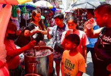 Small businesses suffer income drop amid extreme heat People carry a beverage while traversing the streets in Manila on April 3, 2024. Health experts advise the public to take precautions and stay hydrated as the country experiences high heat levels amid the dry season recently announced by Philippine Atmospheric, Geophysical and Astronomical Services Administration. MARK DEMAYO/ABS-CBN NEWS PHOTO