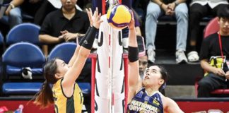 Guimarasnon Camille Lamina of the National University Lady Bulldogs attempts to drop the ball against Far Eastern University Lady Tamaraws’ Gerzel Petallo. UAAP PHOTO
