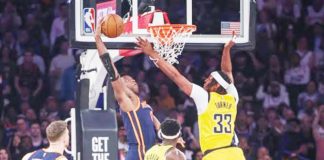 New York Knicks’ OG Anunoby (8) attempts to dunk past Indiana Pacers' Myles Turner (33). PHOTO BY WENDELL CRUZ-USA TODAY SPORTS