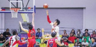 San Miguel Beermen’s June Mar Fajardo goes for a one-hander against the defense of Rain or Shine Elasto Painters’ Leonard Santillan. PBA PHOTO