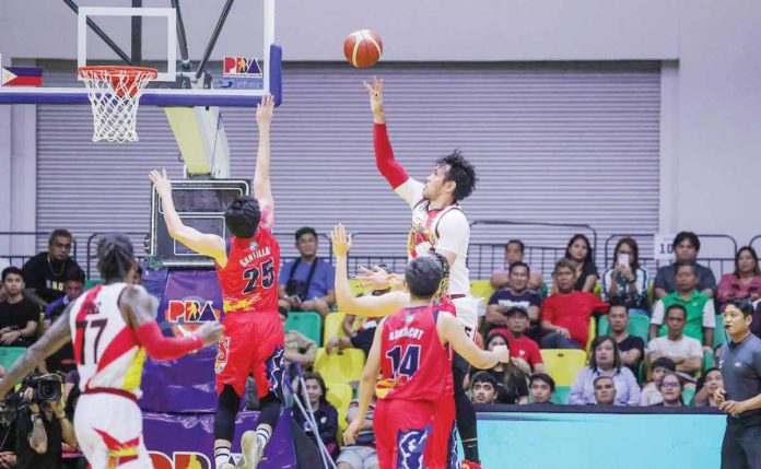 sports-PBA San Miguel Beermen’s June Mar Fajardo goes for a one-hander against the defense of Rain or Shine Elasto Painters’ Leonard Santillan. PBA PHOTO