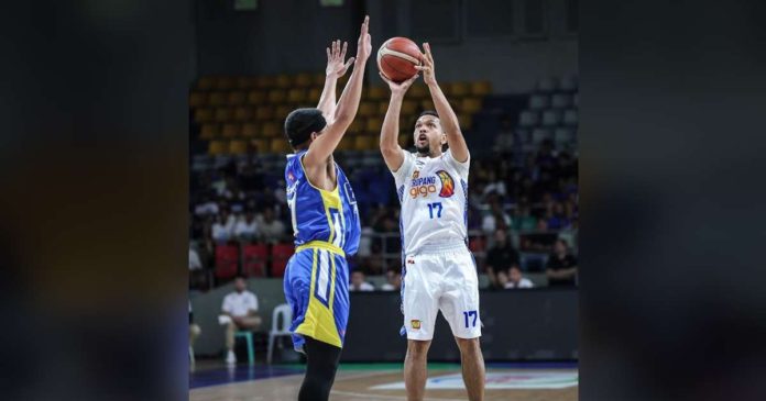 sports PBA_superimposed TNT Tropang Giga’s Jayson Castro shoots over the defense of Magnolia Chicken Timplados Hotshots’ Jerrick Balanza. PBA PHOTO