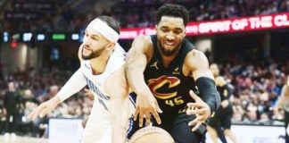 Cleveland Cavaliers’ Donovan Mitchell and Orlando Magic's Jalen Suggs battles for the looseball. PHOTO COURTESY OF USA TODAY SPORTS