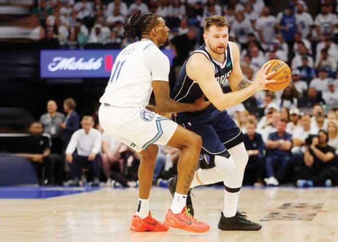 sports_Dallas_resized Dallas Mavericks; Luka Doncic attempts to blow past the defense of Minnesota Timberwolves’ Naz Reid. PHOTO COURTESY OF SPORTSKEEDA