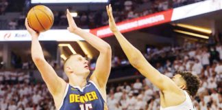 Denver Nuggets’ Nikola Jokić attempts a one-hander shot against Minnesota Timberwolves' Karl-Anthony Towns. PHOTO COURTESY OF SPORTSKEEDA
