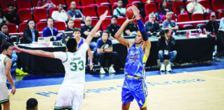 Magnolia Chicken Timplados Hotshots’ Rafi Reavis shoots over the defense of Terrafirma Dyip’s Kemark Carino. PBA PHOTO
