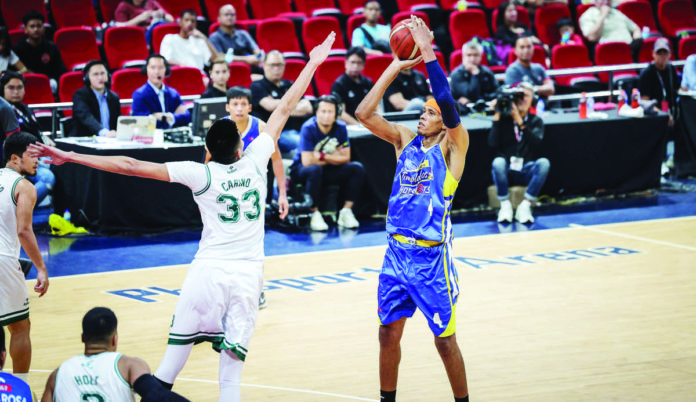 sports_Magnolia_resized Magnolia Chicken Timplados Hotshots’ Rafi Reavis shoots over the defense of Terrafirma Dyip’s Kemark Carino. PBA PHOTO