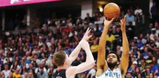 Minnesota Timberwolves’ Karl-Anthony Towns shoots over the defense of Denver Nuggets’ Christian Braun. PHOTO BY ROD CHENOY/USA TODAY SPORTS