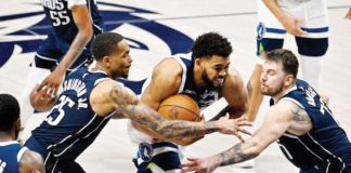Minnesota Timberwolves’ Karl-Anthony Towns (32) drives to the basket past Dallas Mavericks’ P.J. Washington (25) and Luka Doncic (77). PHOTO COURTESY OF JEROME MIRON-USA TODAY SPORTS