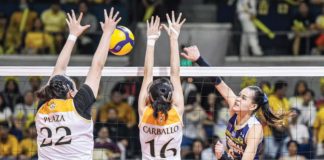 National University Lady Bulldogs’ Evangeline Alinsug scores against the defense of University of Santo Tomas Golden Tigresses’ Bianca Plaza. UAAP PHOTO
