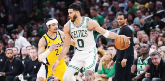 Boston Celtics’ Jayson Tatum (0) moves the ball against the defense of Indiana Pacers’ Andrew Nembhard (2). PHOTO BY DAVID BUTLER II/USA TODAY SPORTS