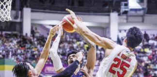 Meralco Bolts’ Raymond Almazan attempts to score against the defense of Barangay Ginebra San Miguel Kings’ Japeth Aguilar. PBA PHOTO