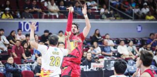 San Miguel Beermen’s June Mar Fajardo pulls up for a shot against the defense of Rain or Shine Elasto Painters’ Beau Belga. PBA PHOTO