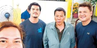 In this 2018 photo, then Davao City mayor Sara Duterte takes a selfie with her father, then President Rodrigo Duterte, and brothers Sebastian and Paolo.