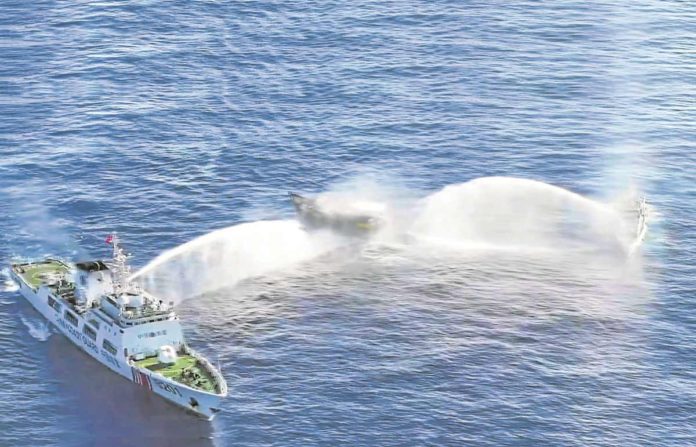 AFP Manila has asked Beijing to order all its vessels to leave Ayungin Shoal following the “dangerous maneuvers” made by the China Coast Guard to block Philippine ships headed for the BRP Sierra Madre on March 5, 2024. An image from aerial footage released by the Philippine Coast Guard shows two CCG vessels blasting their water cannons at Unaizah on May 4. AFP